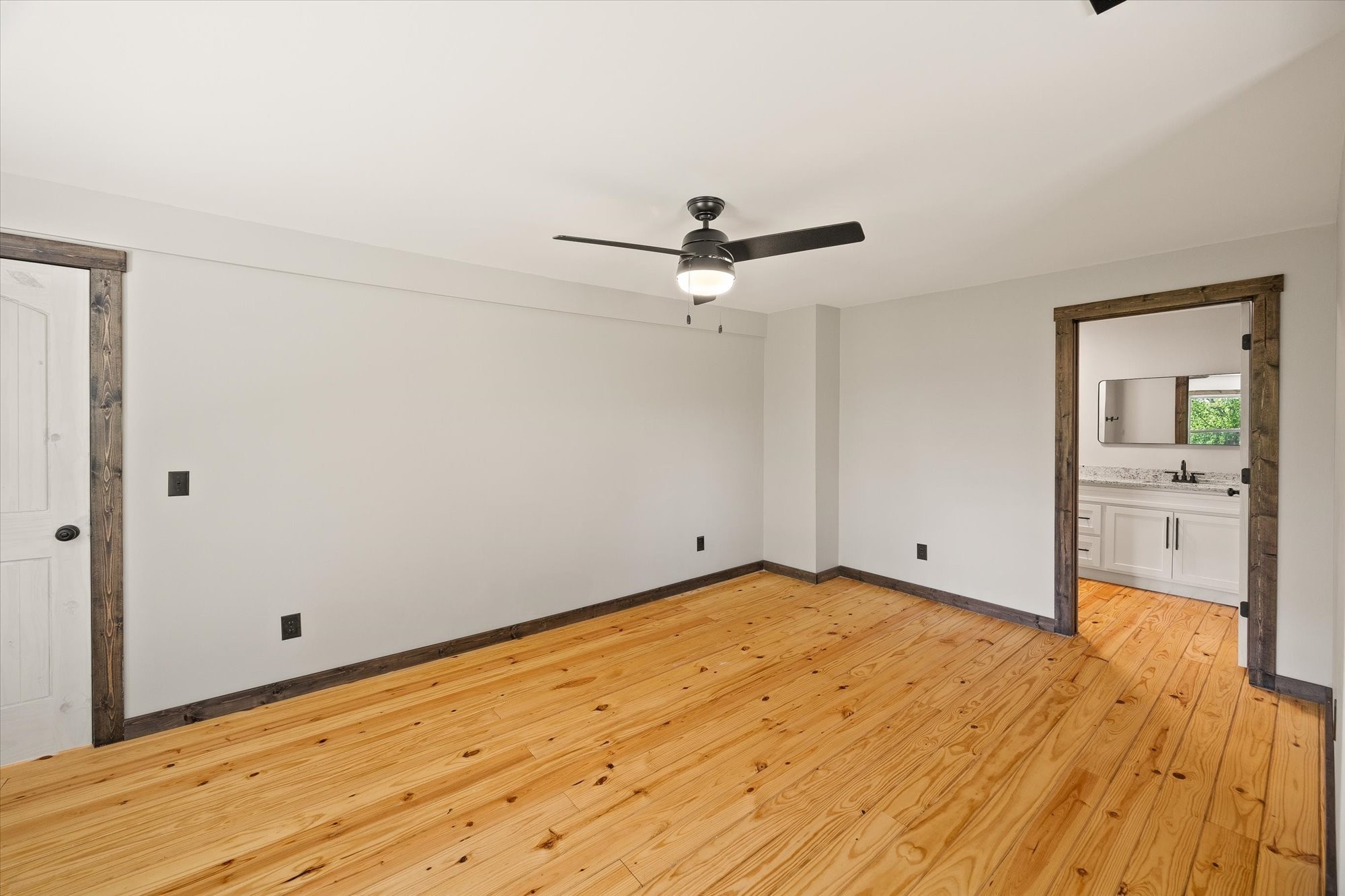 4221 New Hope Road Celina, TN 38551 - Photo 30 of 52 a view of a room with wooden floor and a ceiling fan