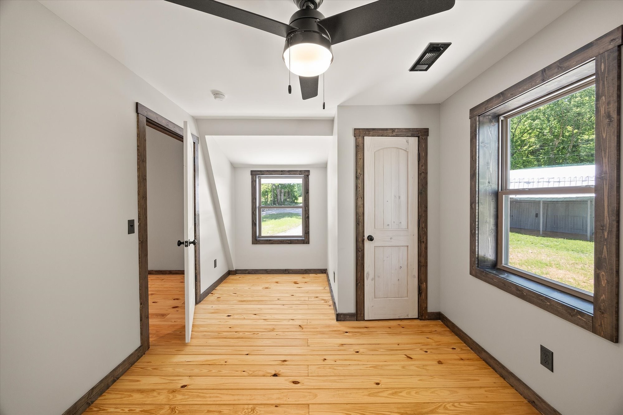4221 New Hope Road Celina, TN 38551 - Photo 35 of 52 a view of an empty room with window and wooden floor