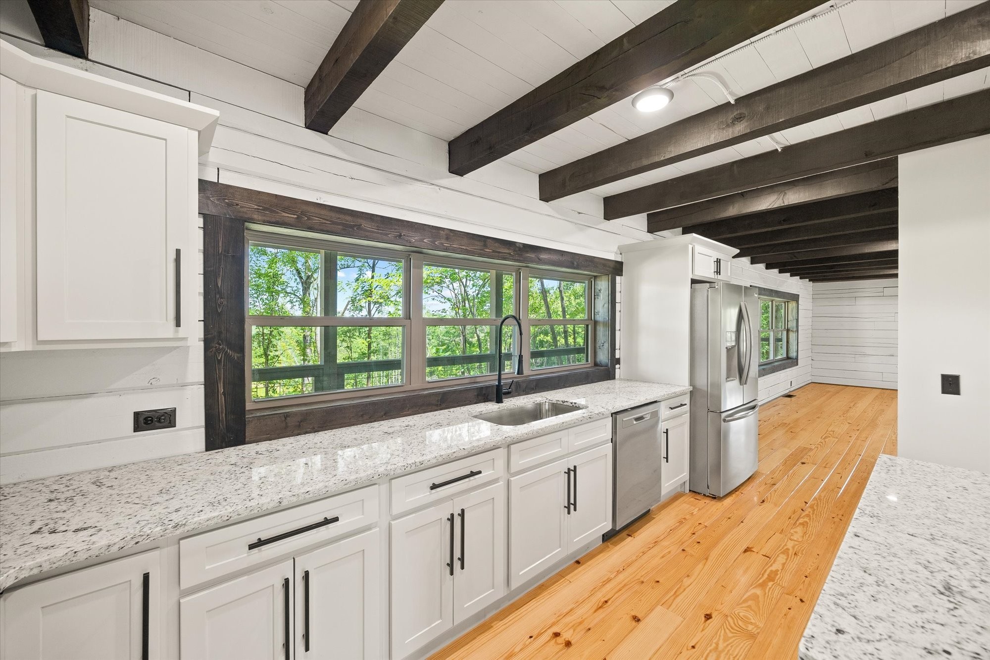 4221 New Hope Road Celina, TN 38551 - Photo 39 of 52 a large white kitchen with granite countertop a large window