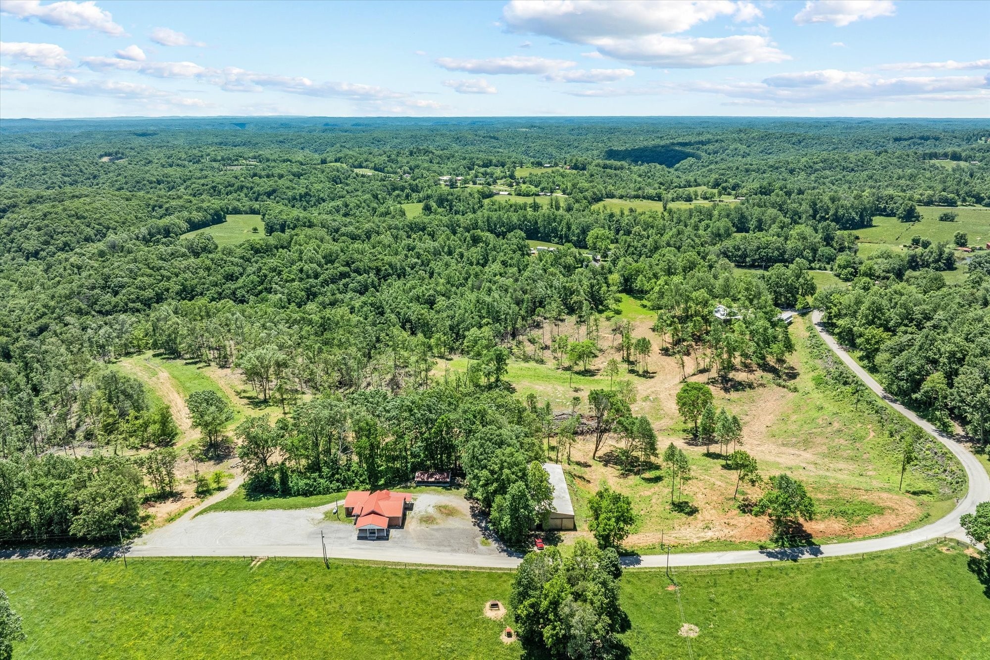 4221 New Hope Road Celina, TN 38551 - Photo 46 of 52 a backyard of a house with a yard and outdoor seating