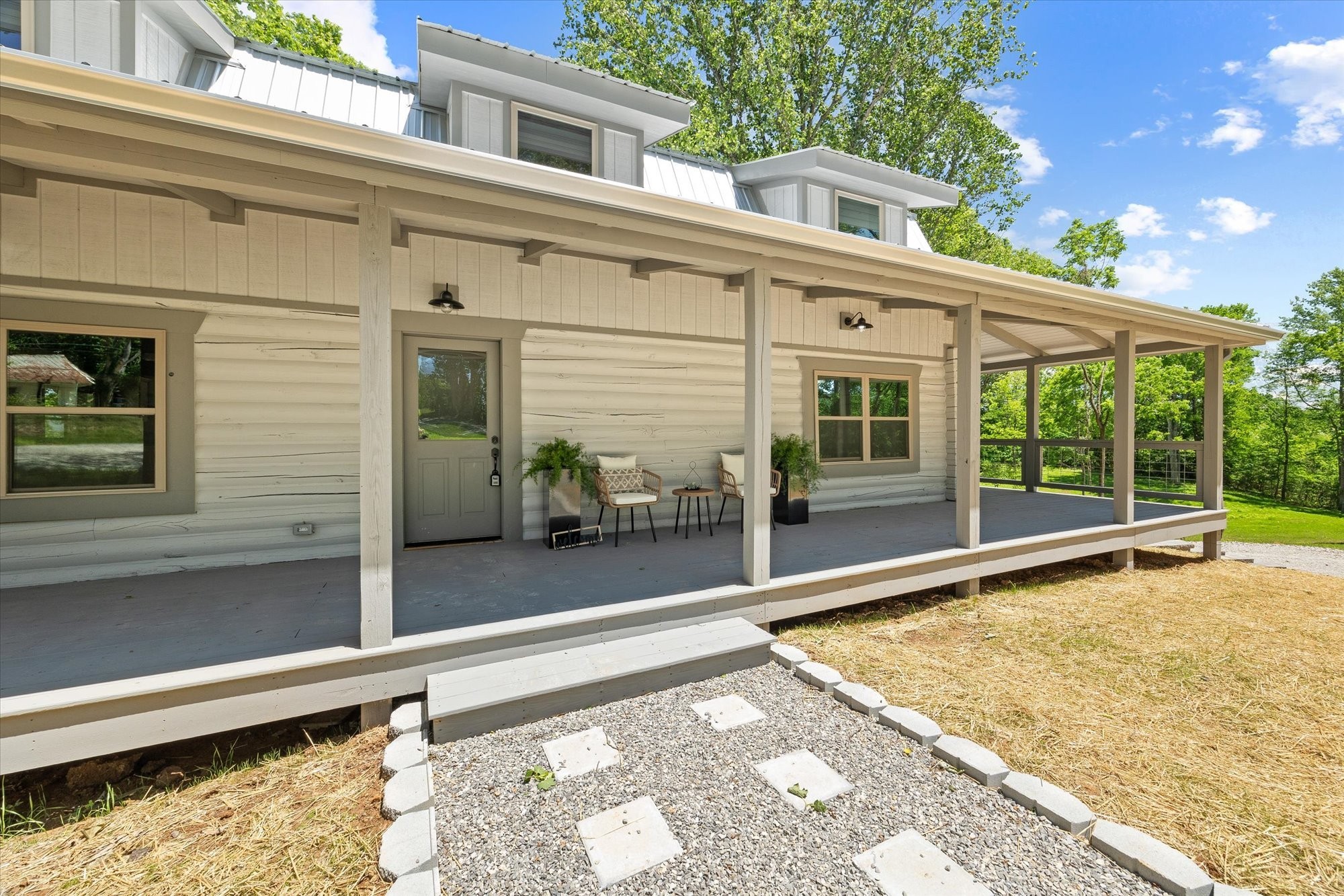 4221 New Hope Road Celina, TN 38551 - Photo 6 of 52 a view of a balcony with floor to ceiling windows and wooden floor