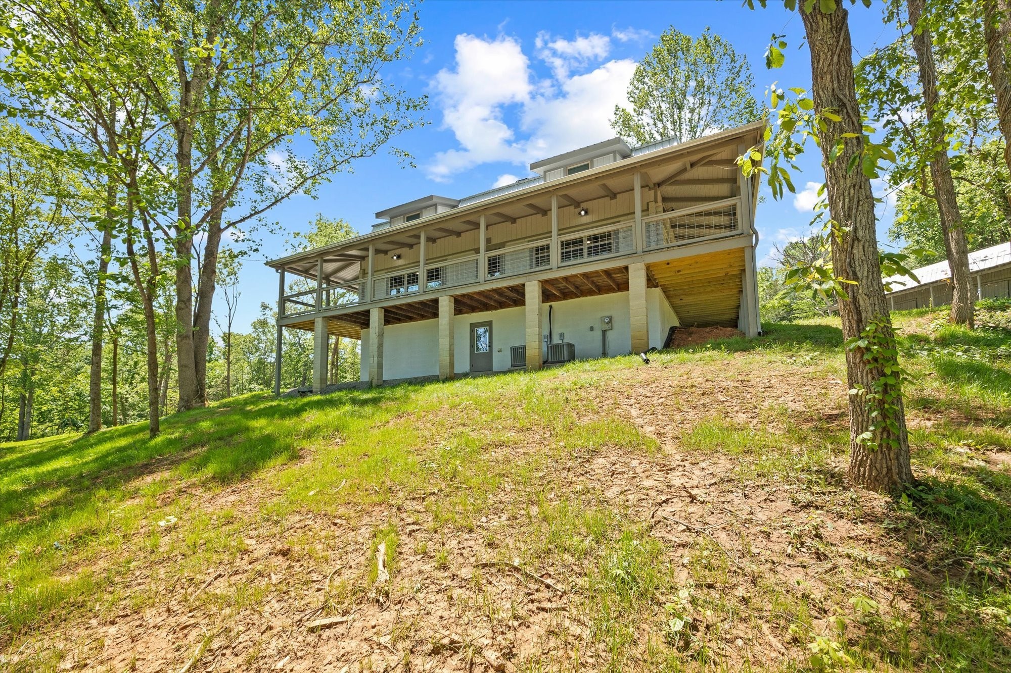 4221 New Hope Road Celina, TN 38551 - Photo 9 of 52 a large house with a large tree in front of it