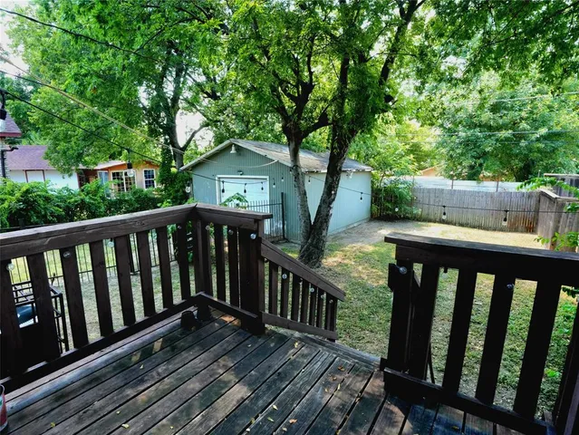 a view of deck with wooden floor and fence