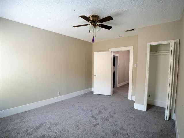 a view of a livingroom with a ceiling fan