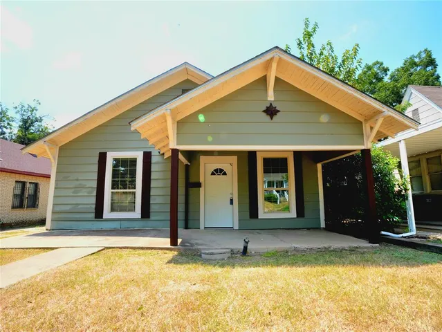 a front view of a house with swimming pool