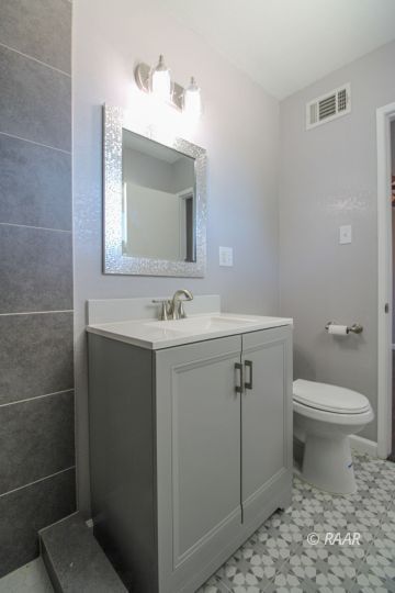 420 Lenore Street Ridgecrest, CA 93555 - Photo 21 of 29 a bathroom with a sink toilet and mirror