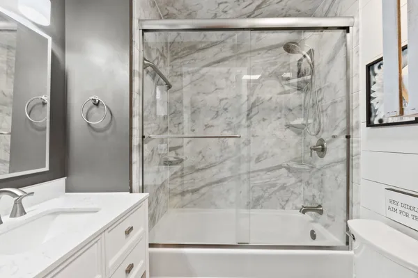a bathroom with a bathtub and a shower