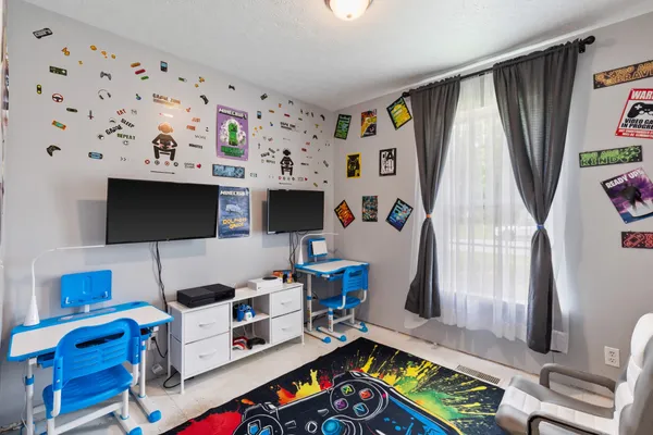 a room with furniture and a flat screen tv