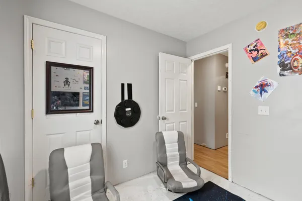 a view of dining room with baby and lounge chair