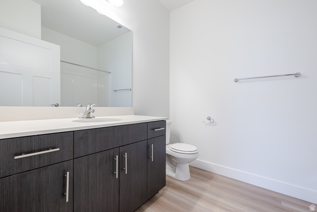 693 West 4500th South, Unit O101 Mapleton, UT 84664 - Photo 6 of 16 Full bathroom with vanity, light wood-type flooring, and a shower