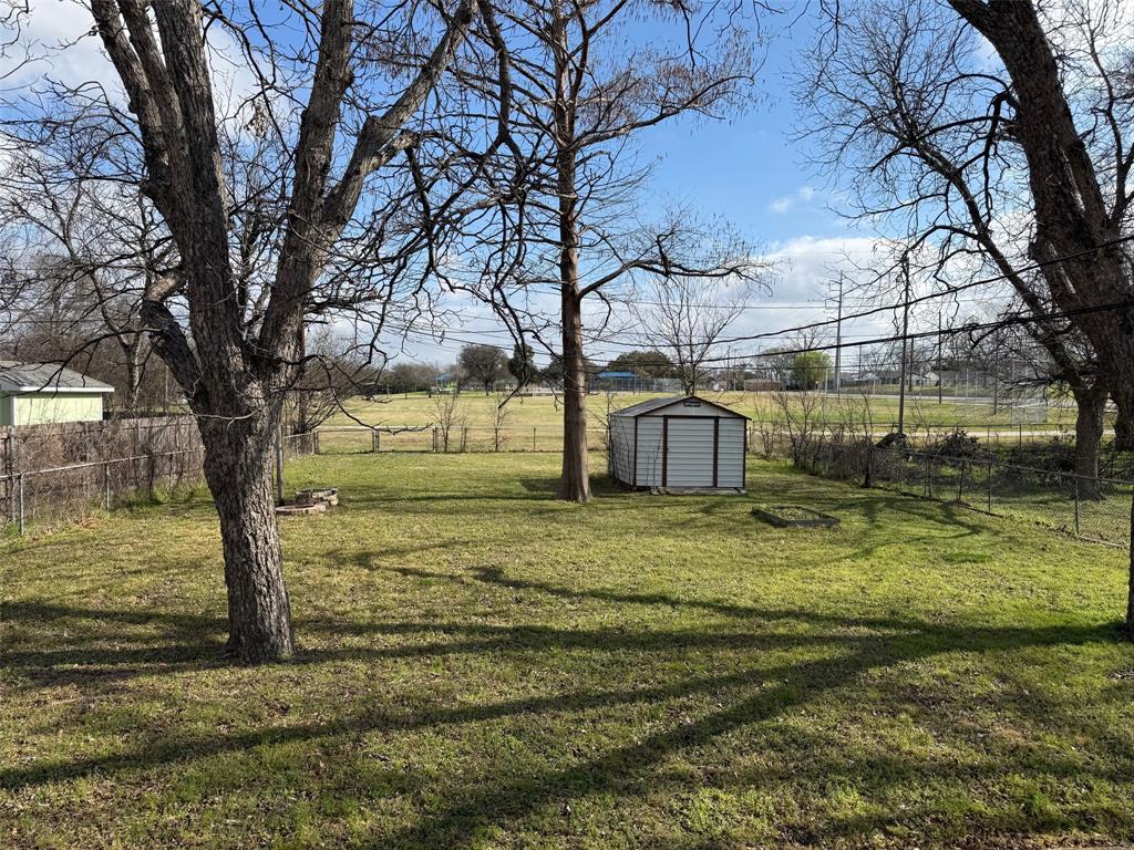 1716 Sheppard Street Waco, TX 76711 - Photo 8 of 13 a view of a yard with large trees