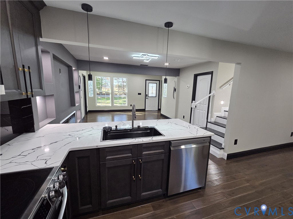 2420 Yarnell Road Henrico, VA 23231 - Photo 14 of 25 a kitchen with a stove and a wooden floor
