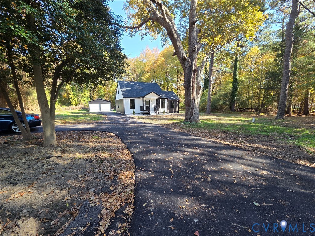 2420 Yarnell Road Henrico, VA 23231 - Photo 2 of 25 a front view of a house with a yard and an trees