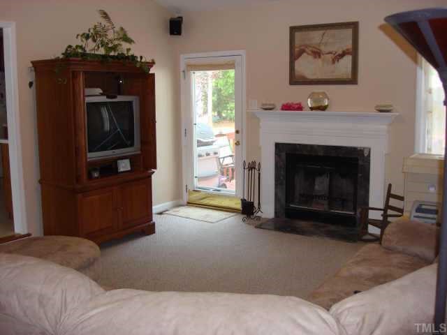 2900 Livery Way Raleigh, NC 27603 - Photo 2 of 10 a living room with furniture and a fireplace
