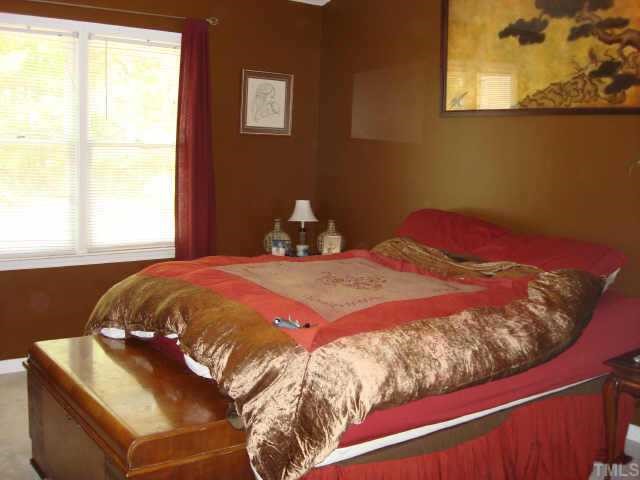 2900 Livery Way Raleigh, NC 27603 - Photo 4 of 10 a bedroom with a bed and a window