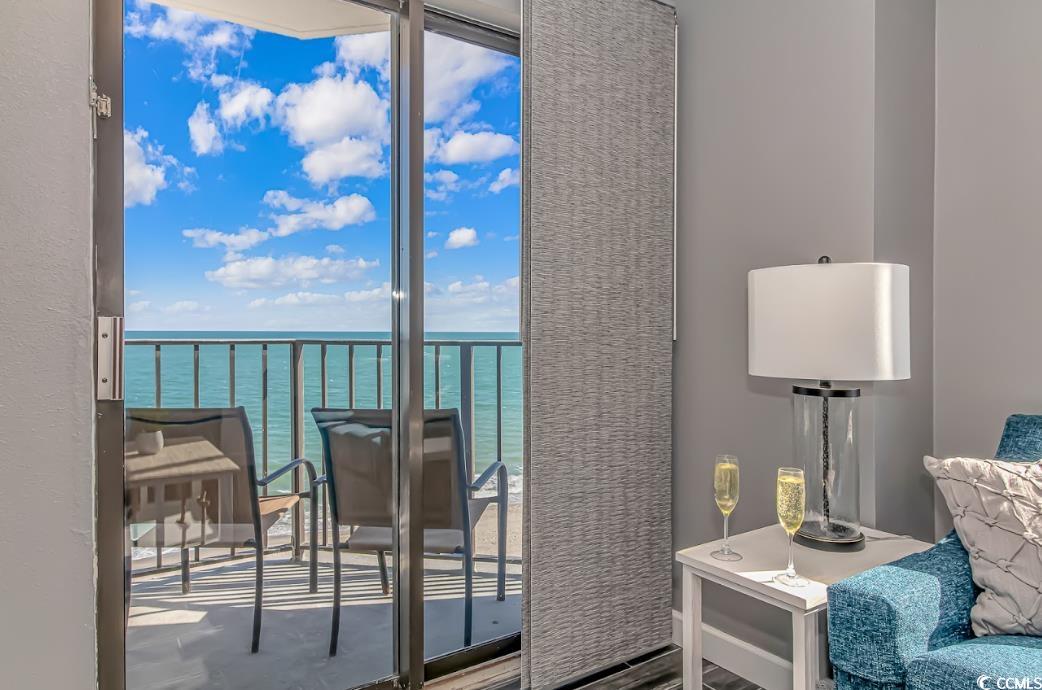 1605 South Ocean Boulevard, Unit 603 Myrtle Beach, SC 29577 - Photo 12 of 40 Sitting room with a water view and wood finished floors