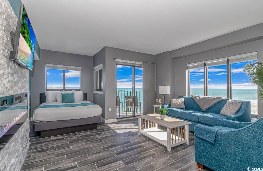 1605 South Ocean Boulevard, Unit 603 Myrtle Beach, SC 29577 - Photo 4 of 40 Bedroom featuring a water view, access to outside, and wood tiled floors