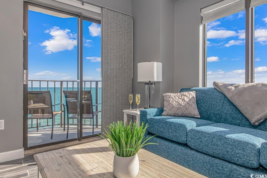 1605 South Ocean Boulevard, Unit 603 Myrtle Beach, SC 29577 - Photo 6 of 40 Living area featuring a water view, healthy amount of natural light, and wood finished floors