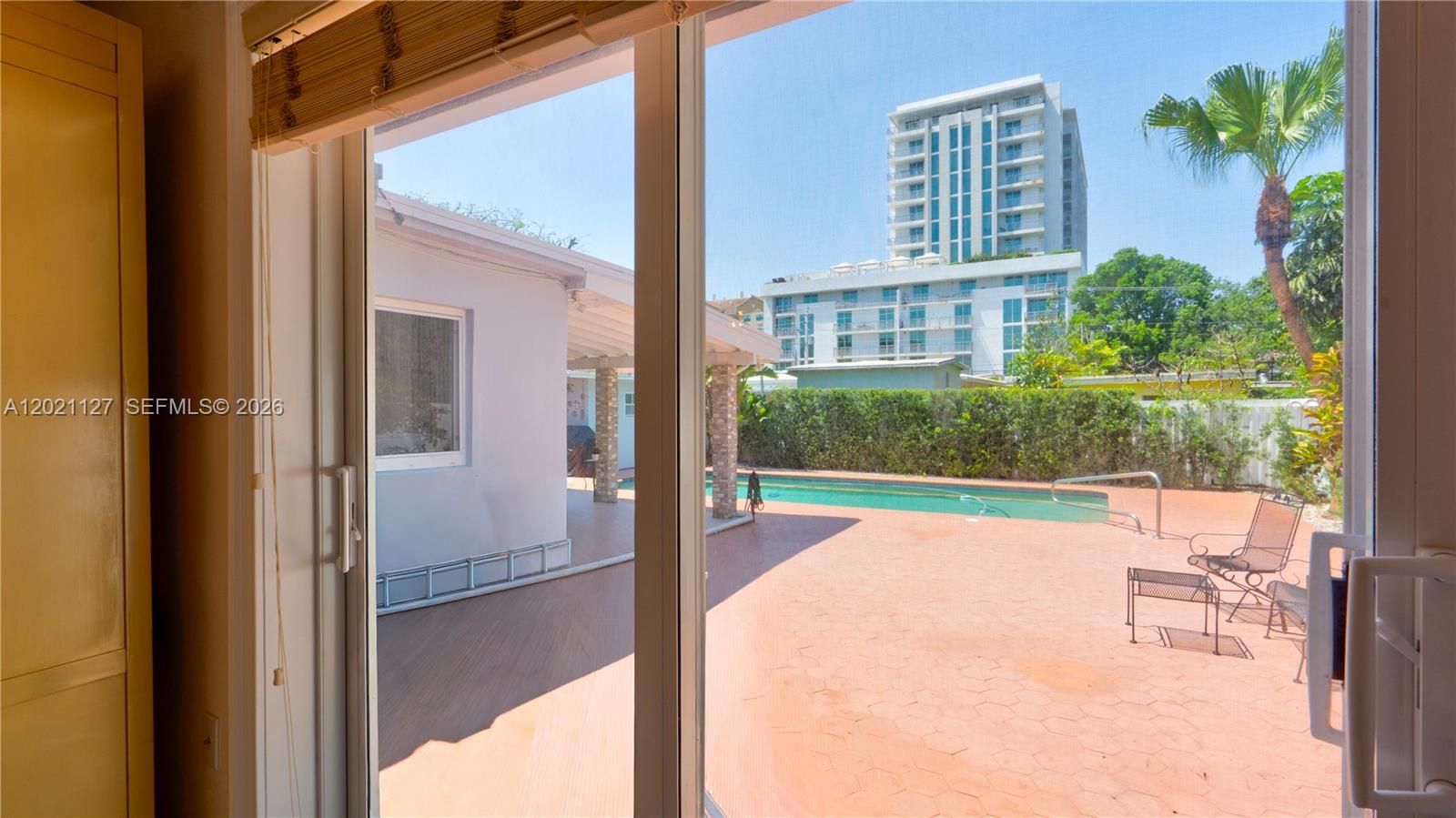 3611 Southwest 23rd Street Miami, FL 33145 - Photo 20 of 56 3613 - impact sliding door with view and acess to pool and patio
