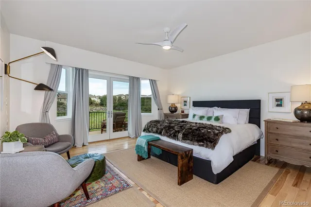 a bedroom with a bed couch and window