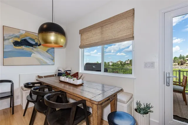 a dining room with furniture and window