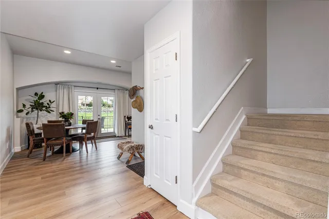 a view of a livingroom with furniture and hardwood floor