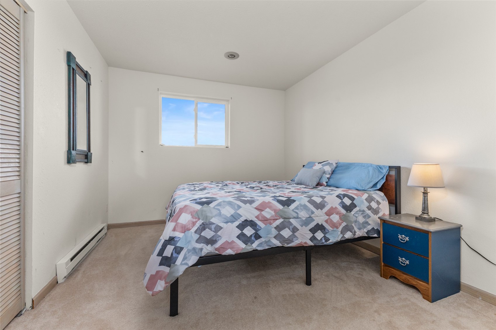 151 Jcr 26 Walden, CO 80430 - Photo 21 of 28 a bedroom with a bed and a lamp