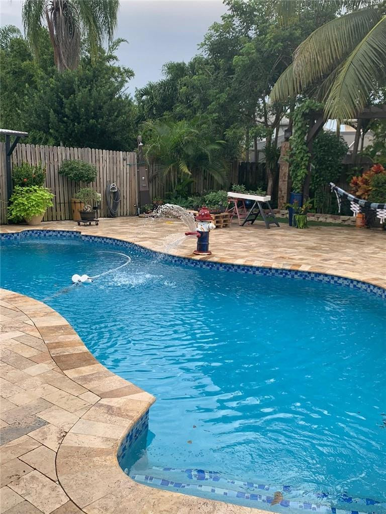 22909 Old Inlet Bridge Drive Boca Raton, FL 33433 - Photo 9 of 9 a swimming pool with outdoor seating and yard