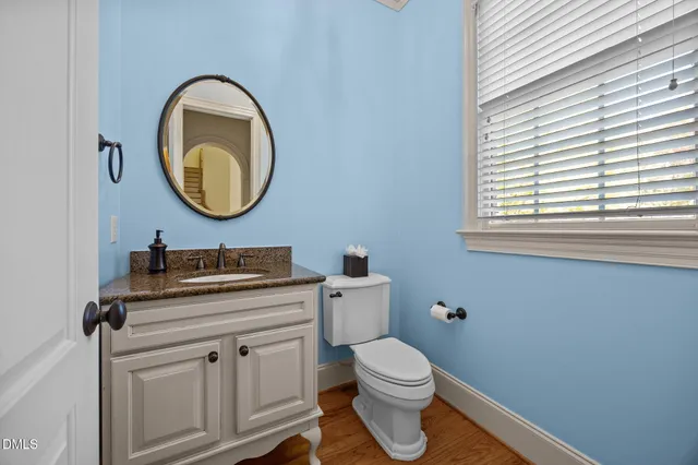 a view of a dining room with furniture wooden floor and a chandelier