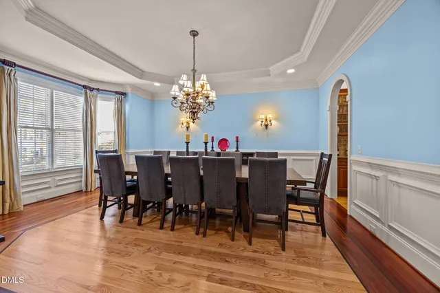 a view of a dining room with furniture and wooden floor