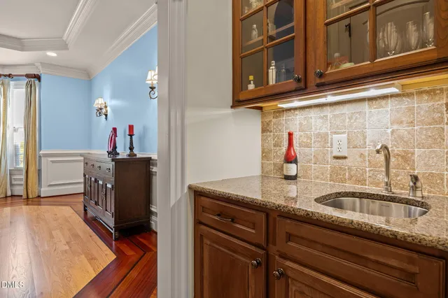 a living room with furniture fireplace and wooden floor