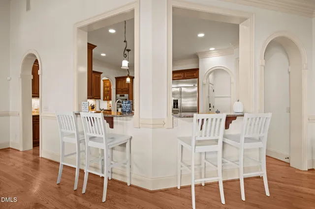 a bedroom with a bed a window and dresser