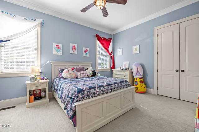 a living room with furniture a table and a flat screen tv
