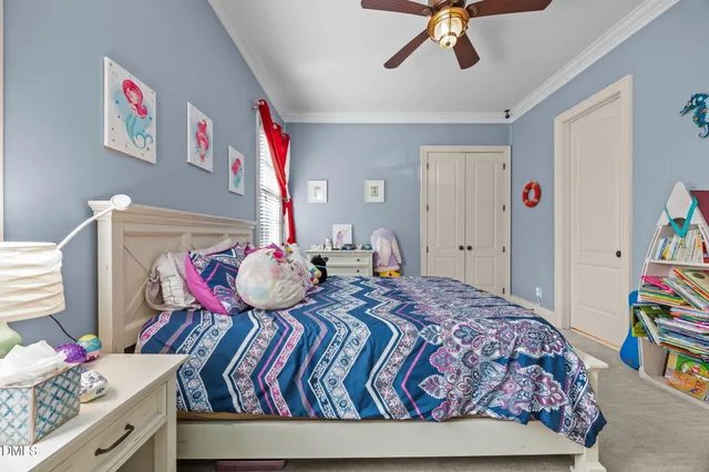 a room with pool table and windows