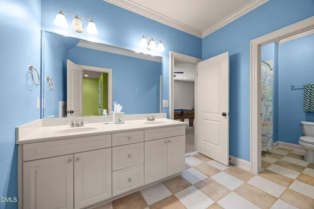 an empty room with a kitchen and a wooden floor