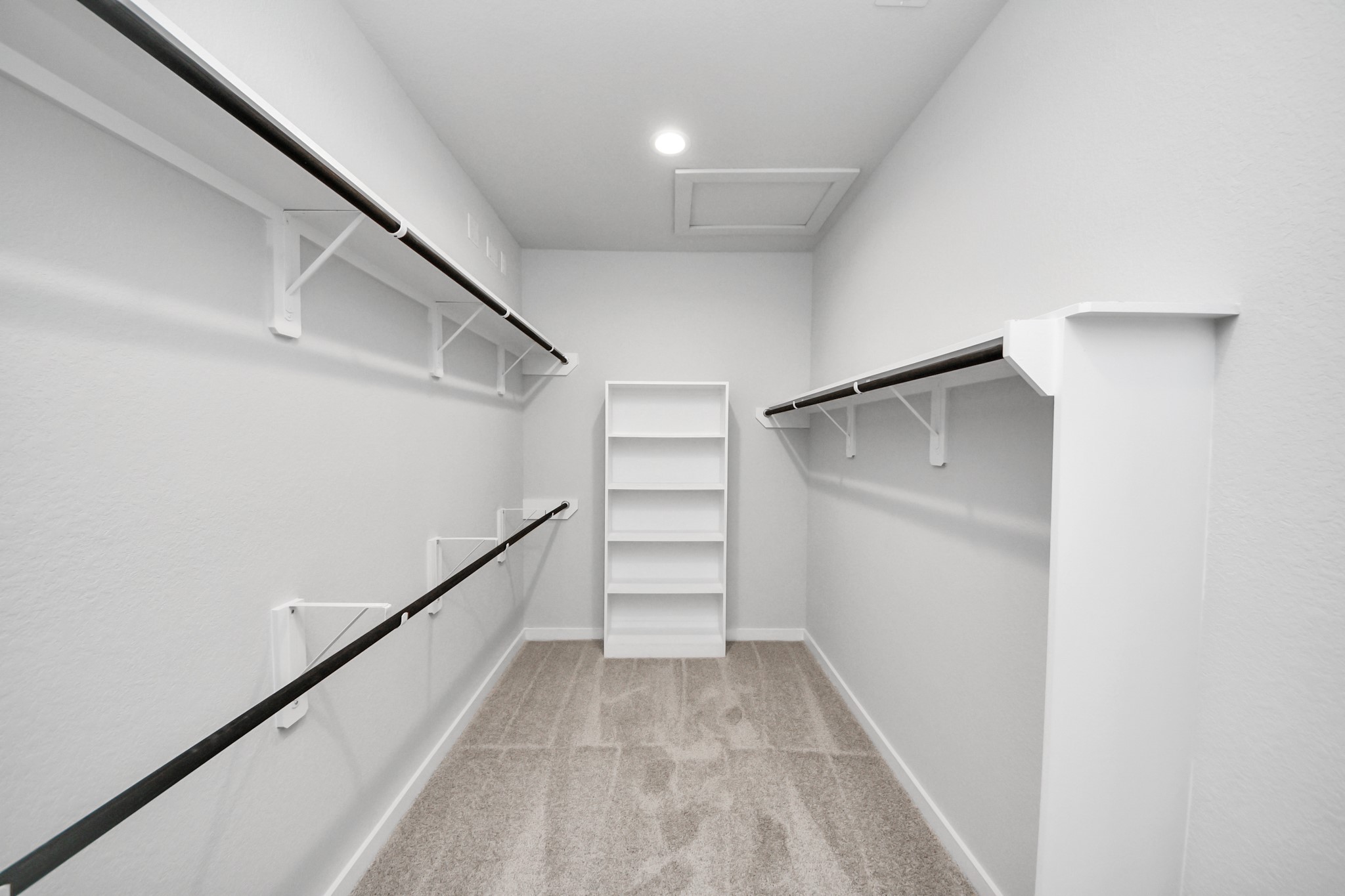 3002 Bury Park Dr Spring Spring, TX 77373 - Photo 29 of 45 Walk-in closet that epitomizes luxury and practicality. This generously sized space features built-in shelving, offering abundant room for impeccable organization. High ceilings and recessed lighting create a bright and welcoming ambiance.