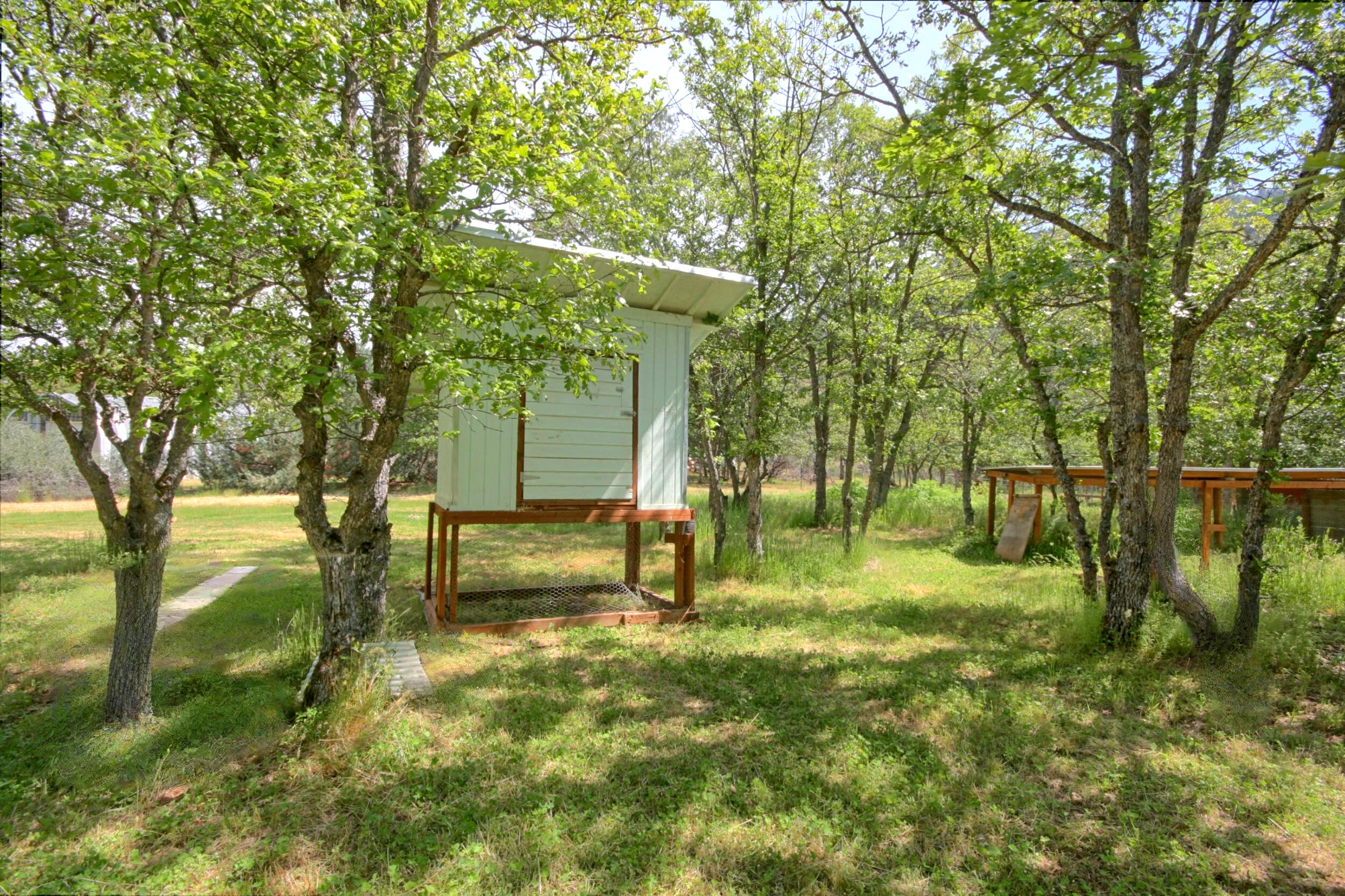 8150 Upper Applegate Road Jacksonville, OR 97530 - Photo 107 of 122 a backyard of a house with lots of green space and fountain