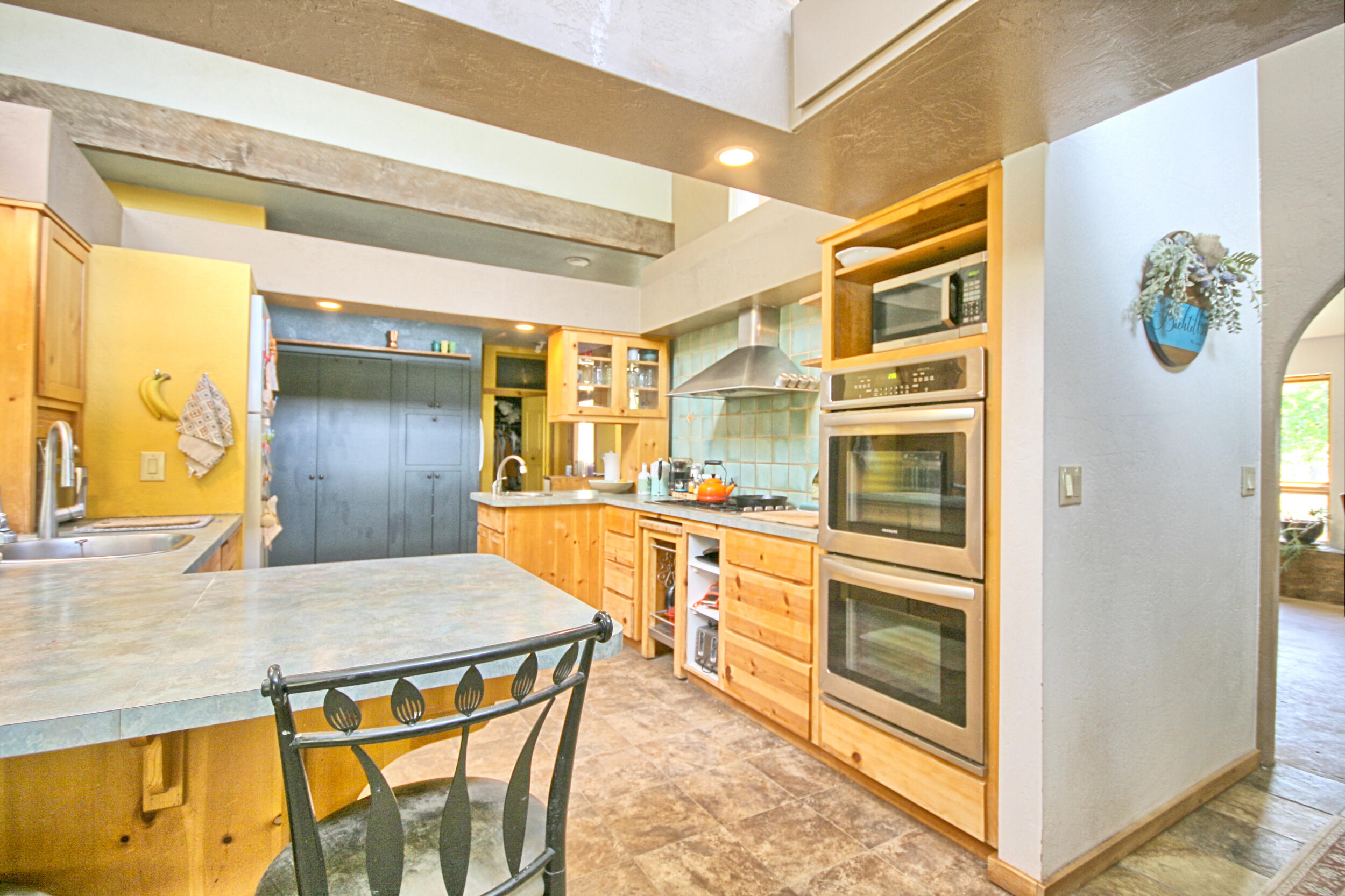 8150 Upper Applegate Road Jacksonville, OR 97530 - Photo 17 of 122 a kitchen with stainless steel appliances granite countertop a sink and a refrigerator