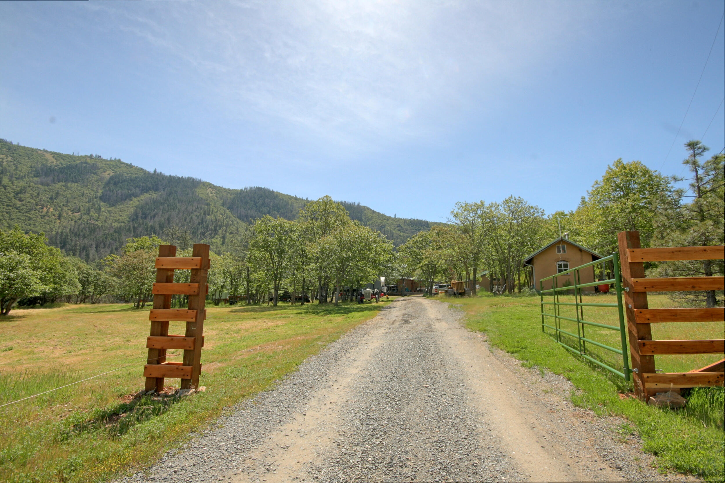 8150 Upper Applegate Road Jacksonville, OR 97530 - Photo 2 of 122 a view of a town with mountains in the background