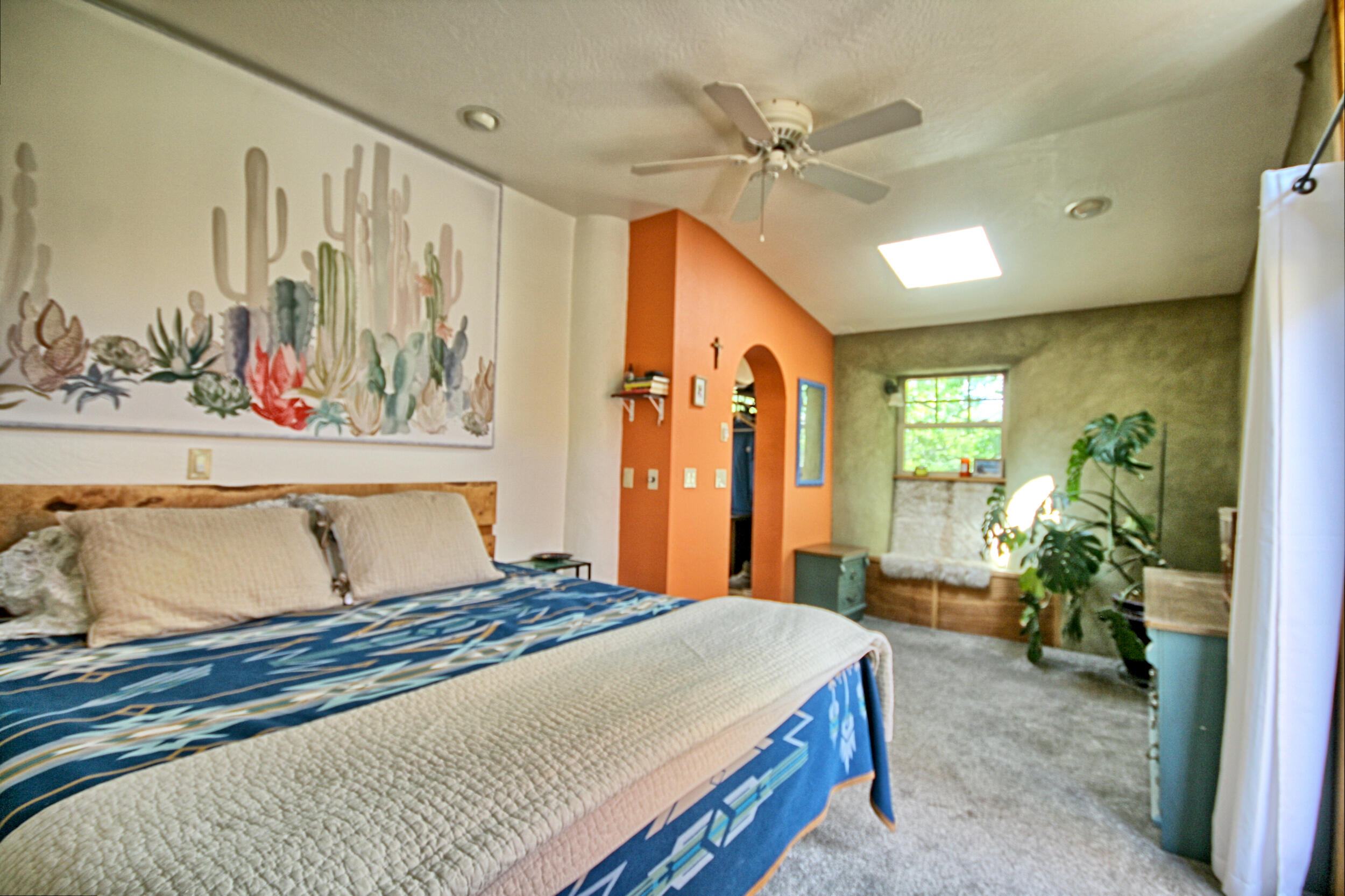 8150 Upper Applegate Road Jacksonville, OR 97530 - Photo 33 of 122 a bedroom with a balcony a bed and a painting on the wall
