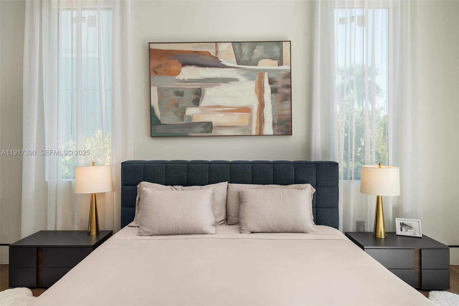 900 Washington Street Hollywood, FL 33019 - Photo 27 of 61 a large bed sitting in a bedroom next to a window