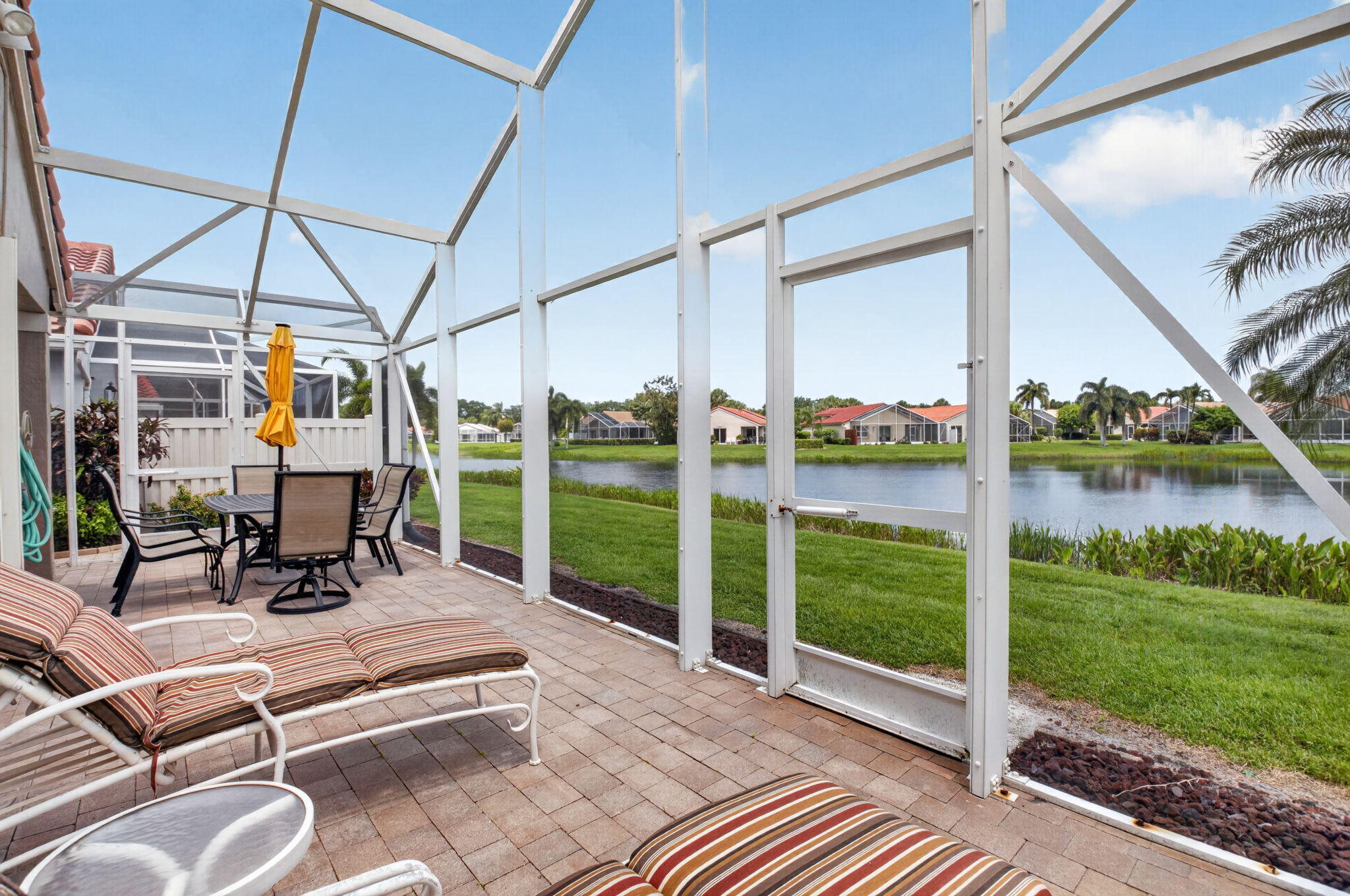 11592 Lawton Road Boynton Beach, FL 33437 - Photo 32 of 96 Screened in Extended Patio