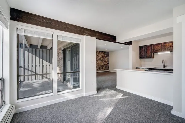 a kitchen with stainless steel appliances a refrigerator and a stove top oven