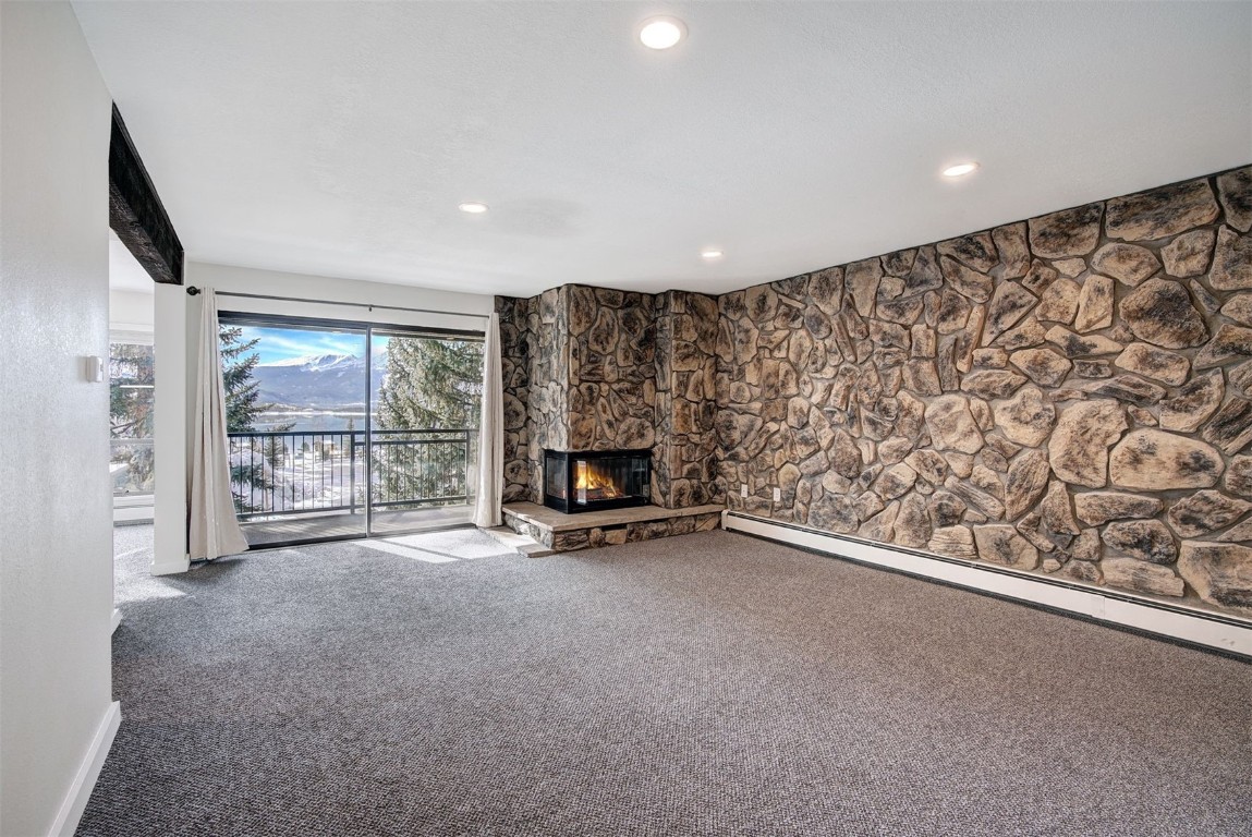 120 La Bonte Street, Unit 202 Dillon, CO 80435 - Photo 4 of 29 an empty room with a fireplace and large window