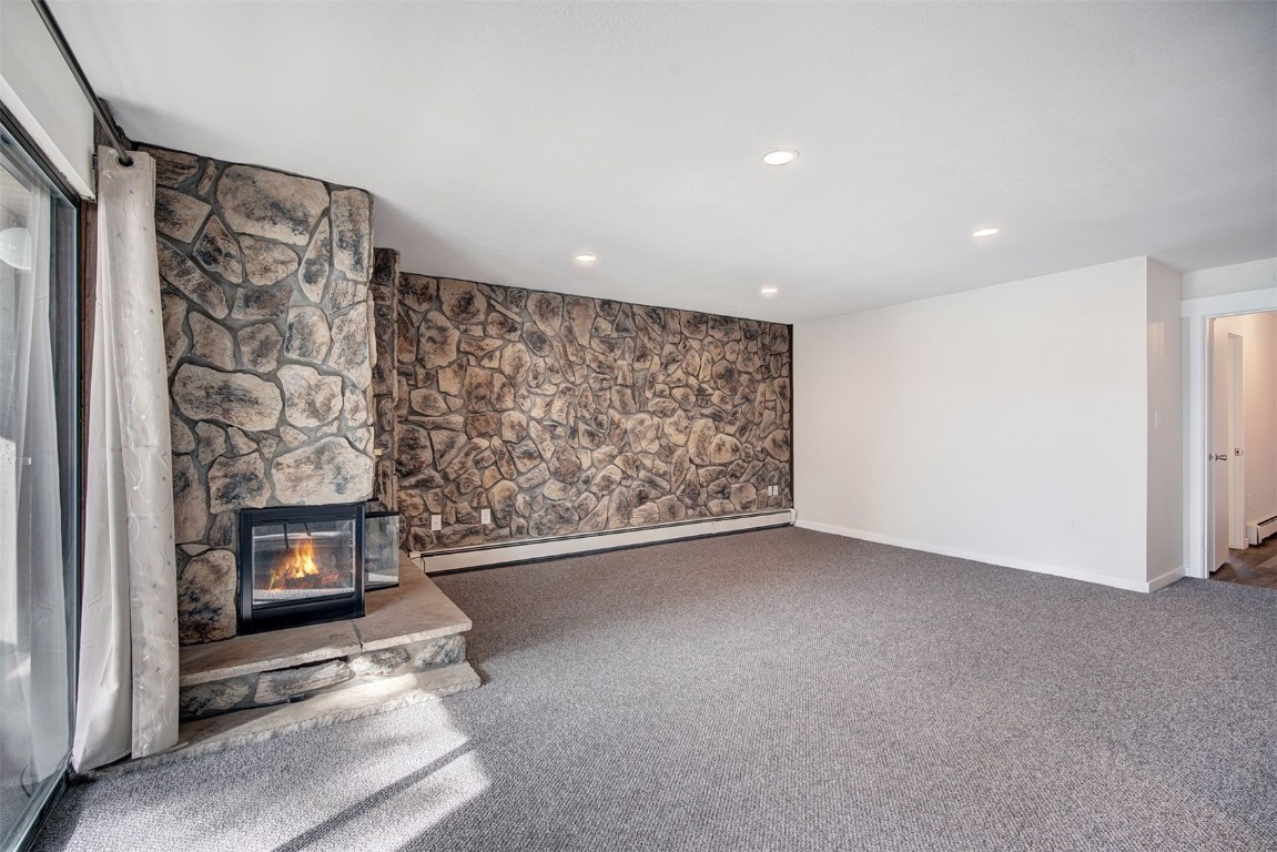 120 La Bonte Street, Unit 202 Dillon, CO 80435 - Photo 7 of 29 a view of an empty room with a fireplace and a window