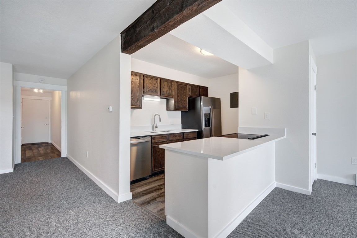 120 La Bonte Street, Unit 202 Dillon, CO 80435 - Photo 9 of 29 a kitchen that has a sink and a stove in it