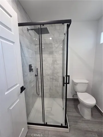 a bathroom with a glass shower door