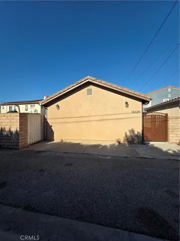 a view of backyard and garage
