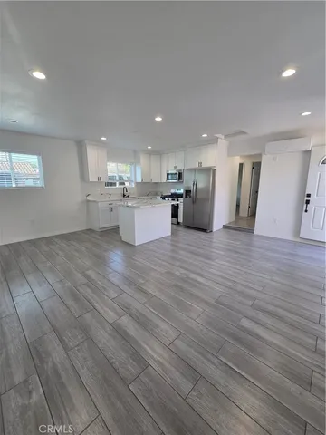 a view of a kitchen with cabinets