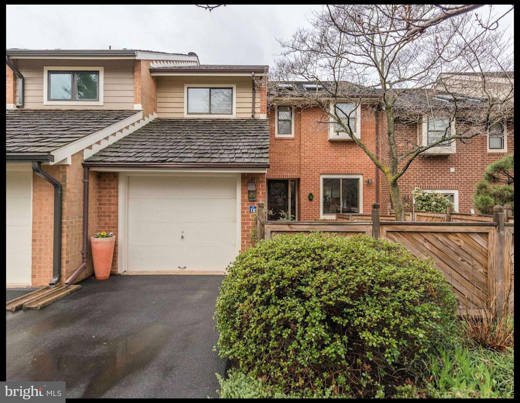 11076 Thrush Ridge Road Reston, VA 20191 - Photo 1 of 29 a front view of a house with a garden